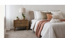 Comfortable bedroom with carpet flooring